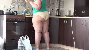 bbw housewife in the kitchen in panties and slippers