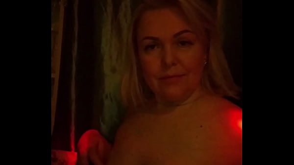 Mature plays with her tits